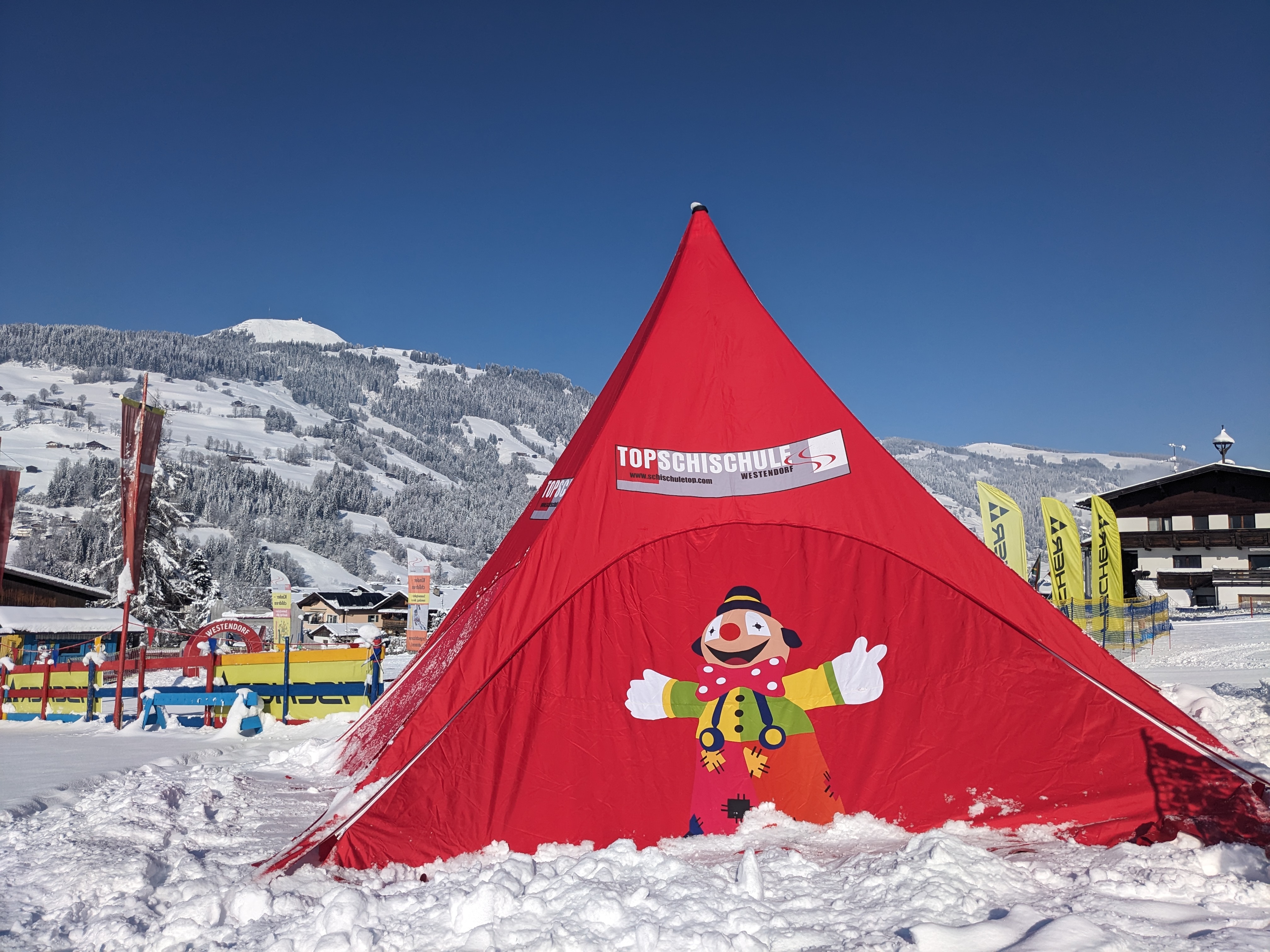 Red tent with a clown in the children’s play area on the Westendorf practice field